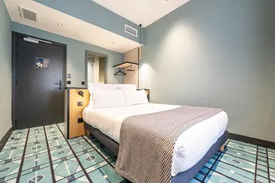 Un ou plusieurs lits dans un hébergement de l'établissement Hôtel CASA MOHO - Juan-Les-Pins
