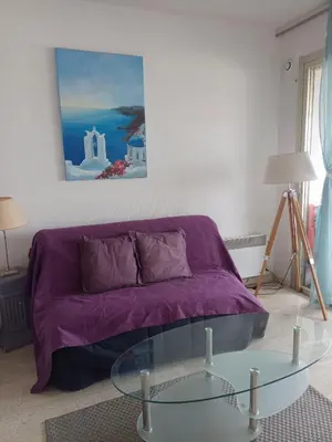 Coin salon dans l'établissement Grand studio vue mer à Marina Baie des Anges