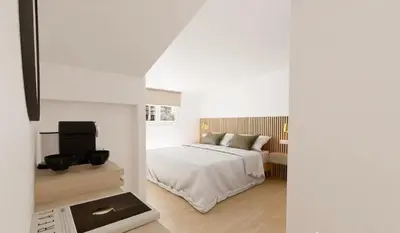 Un ou plusieurs lits dans un hébergement de l'établissement Hotel le Romanesque