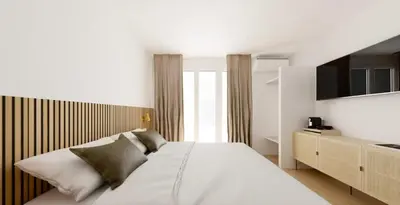 Un ou plusieurs lits dans un hébergement de l'établissement Hotel le Romanesque