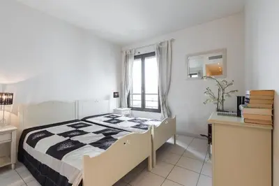 Un ou plusieurs lits dans un hébergement de l'établissement Appartement de charme à Cannes + terrasse