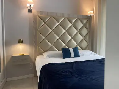 Un ou plusieurs lits dans un hébergement de l'établissement Hotel Le Fouquet's
