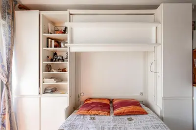 Un ou plusieurs lits dans un hébergement de l'établissement Appartement charmant à Antibes, 33 m², piscine partagée