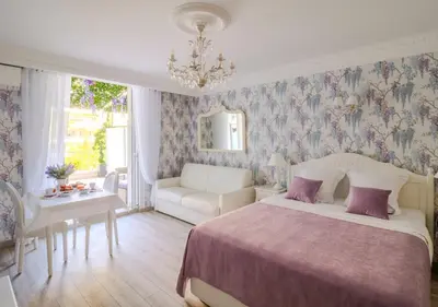 Un ou plusieurs lits dans un hébergement de l'établissement Cannes Imperial Croisette Palais Miramar