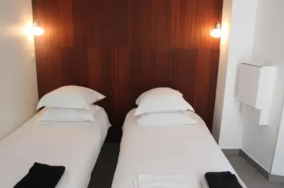 Un ou plusieurs lits dans un hébergement de l'établissement Villa Le Ruisseau