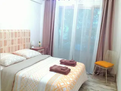 Un ou plusieurs lits dans un hébergement de l'établissement Residences Fleuries - behind Cannes Croisette Bvd