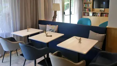 Coin salon dans l'établissement Hapimag Apartments Antibes