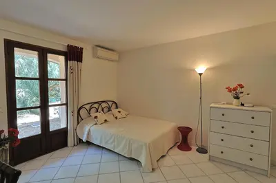 Un ou plusieurs lits dans un hébergement de l'établissement Villa climatisée de 195 m2 avec piscine privée