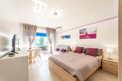 Un ou plusieurs lits dans un hébergement de l'établissement L'Ascot Appartement, plages à 300m, vue hippodrome