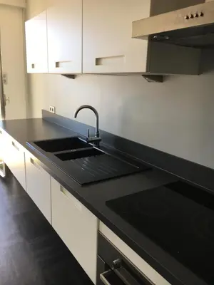 Cuisine ou kitchenette dans l'établissement Appartement Le Palais Des Iles