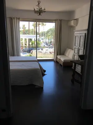 Un ou plusieurs lits dans un hébergement de l'établissement Appartement Le Palais Des Iles