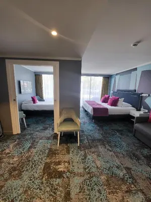 Un ou plusieurs lits dans un hébergement de l'établissement Juliana Hotel Cannes