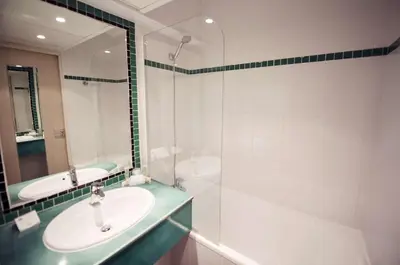 Salle de bains dans l'établissement Best Western Astoria
