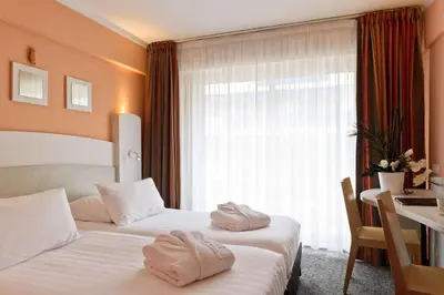 Un ou plusieurs lits dans un hébergement de l'établissement Best Western Astoria
