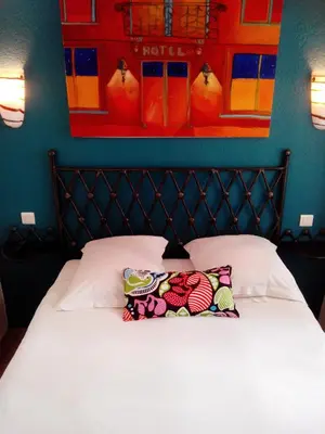 Un ou plusieurs lits dans un hébergement de l'établissement Hôtel Brimer Cannes
