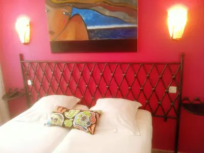 Un ou plusieurs lits dans un hébergement de l'établissement Hôtel Brimer Cannes