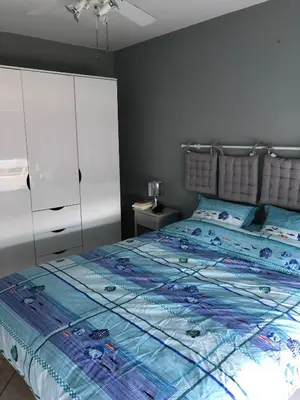 Un ou plusieurs lits dans un hébergement de l'établissement appartement vue mer panoramique