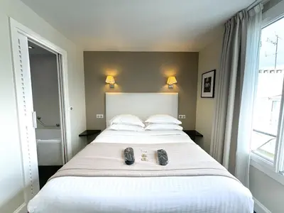 Un ou plusieurs lits dans un hébergement de l'établissement Hôtel de Provence