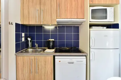 Cuisine ou kitchenette dans l'établissement Résidence Pierre & Vacances Premium Port Prestige
