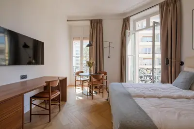 Un ou plusieurs lits dans un hébergement de l'établissement La Guitare 23 - Large modern studio with balcony in center of Cannes, just behind Grand Hotel