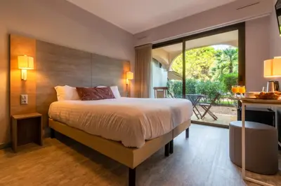 Un ou plusieurs lits dans un hébergement de l'établissement Hôtel Bahia