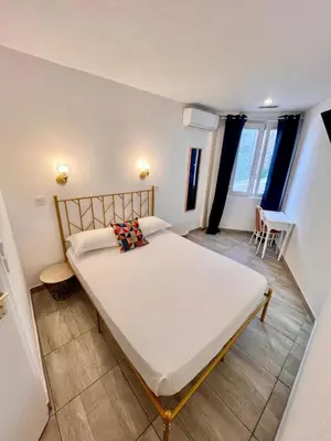 Un ou plusieurs lits dans un hébergement de l'établissement Appia Hotel