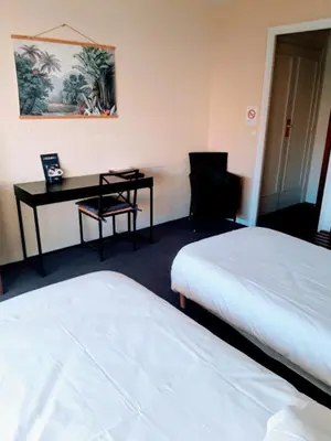 Un ou plusieurs lits dans un hébergement de l'établissement Hôtel Restaurant Brasilia