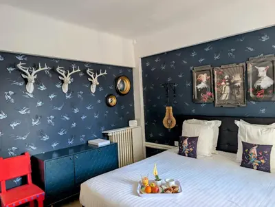 Un ou plusieurs lits dans un hébergement de l'établissement Hôtel Mademoiselle