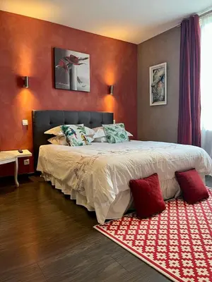 Un ou plusieurs lits dans un hébergement de l'établissement VILLA BEAUSEJOUR