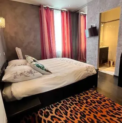 Un ou plusieurs lits dans un hébergement de l'établissement VILLA BEAUSEJOUR