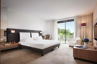 Un ou plusieurs lits dans un hébergement de l'établissement Mouratoglou Hotel & Resort