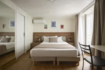 Un ou plusieurs lits dans un hébergement de l'établissement Hotel des Congrès et Festivals