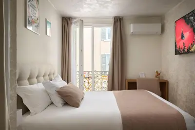 Un ou plusieurs lits dans un hébergement de l'établissement Hotel des Congrès et Festivals