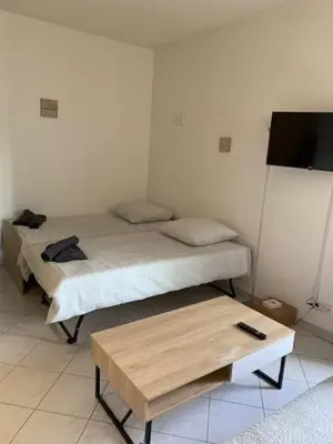 Un ou plusieurs lits dans un hébergement de l'établissement Studio CENTRE CROISETTE