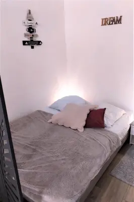 Un ou plusieurs lits dans un hébergement de l'établissement Magnifique studio coeur Vieil Antibes