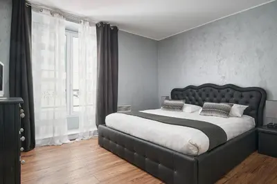 Un ou plusieurs lits dans un hébergement de l'établissement Apparthotel des Congrès et Festivals