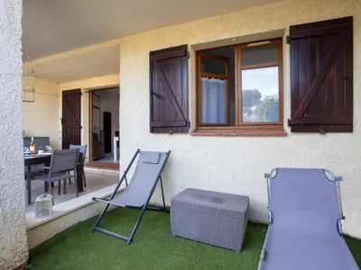 Coin salon dans l'établissement Apartment La Calmeraie by Interhome