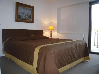 Un ou plusieurs lits dans un hébergement de l'établissement Appartement Relais de la Reine Cannes Croisette