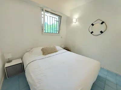 Un ou plusieurs lits dans un hébergement de l'établissement Plage la Salis 3 chambres, Jardin - 3 bedrooms