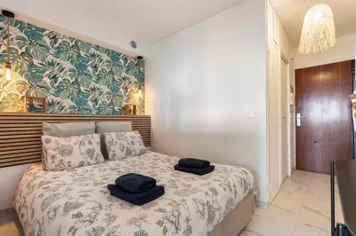Un ou plusieurs lits dans un hébergement de l'établissement Vue mer 180° cocon à 7 min de la plage piscine AC