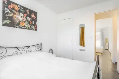 Un ou plusieurs lits dans un hébergement de l'établissement Appartement Corail - Welkeys