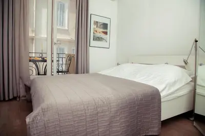 Un ou plusieurs lits dans un hébergement de l'établissement AnaZa Appartement