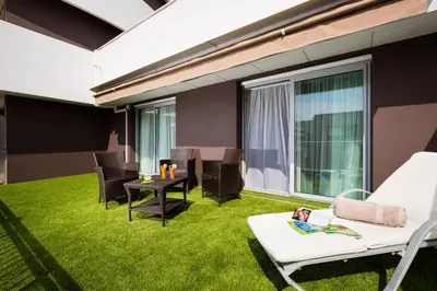 Coin salon dans l'établissement Hôtel Hélios