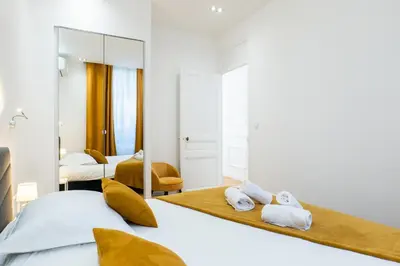 Un ou plusieurs lits dans un hébergement de l'établissement 3-Br Apartment in the heart of downtown