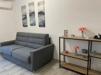 Coin salon dans l'établissement Appartement de charme à 2 min de la plage