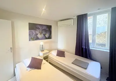 Un ou plusieurs lits dans un hébergement de l'établissement Viva Riviera Central 1 Bedroom Place Gambetta
