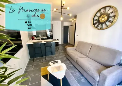 Coin salon dans l'établissement Le Marignan SCLS - Wifi, Climatisation