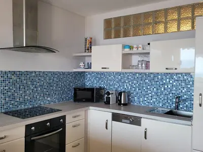 Cuisine ou kitchenette dans l'établissement Center Bay T4