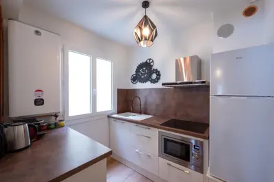 Cuisine ou kitchenette dans l'établissement Tredici- Appartment