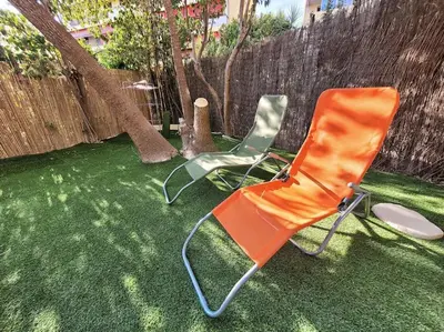 Jardin de l'établissement Parking privé + Jardin + Clim proche Plage & Resto
